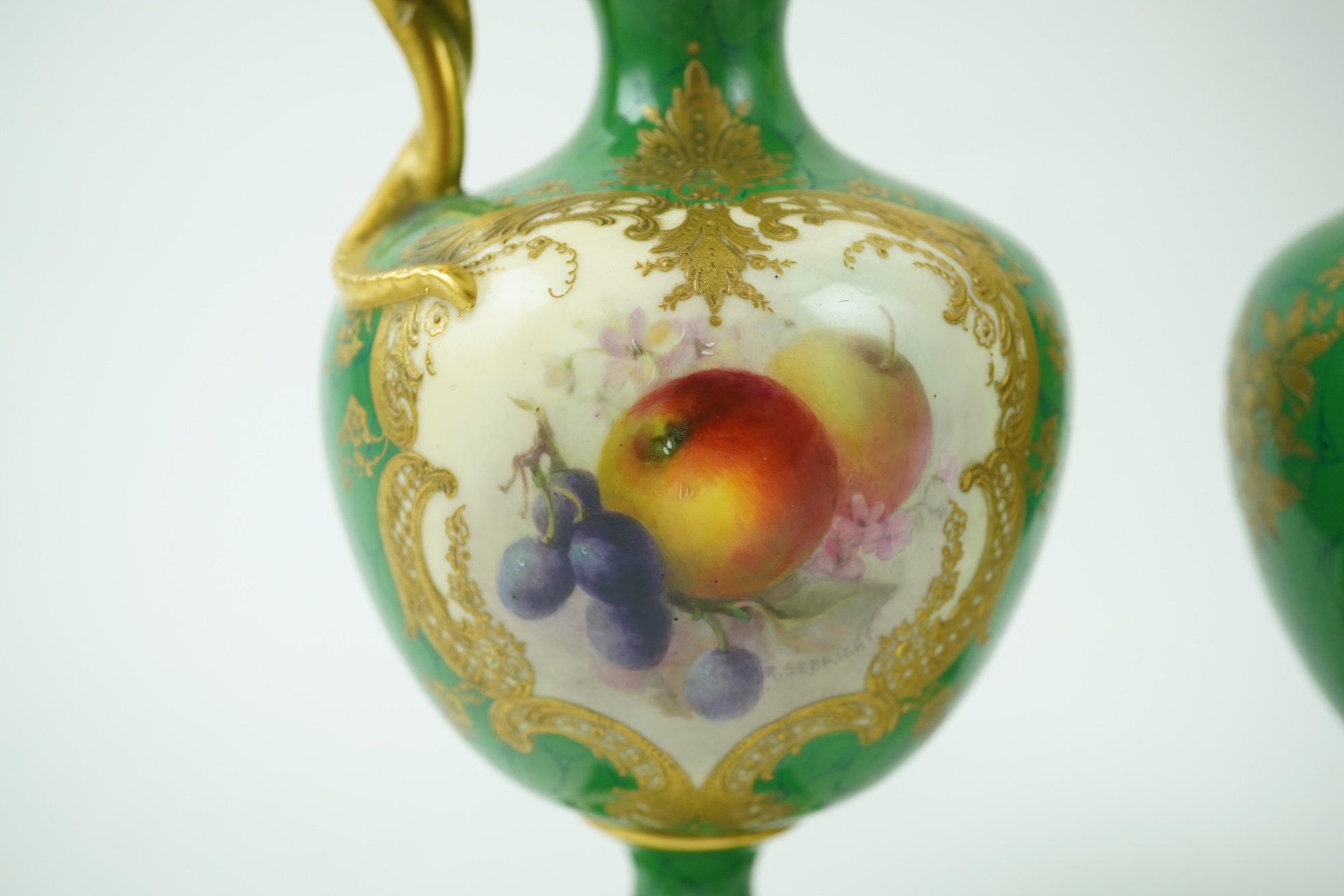 A pair of Royal Worcester fruit painted ewers, by R. Sebright, c.1903